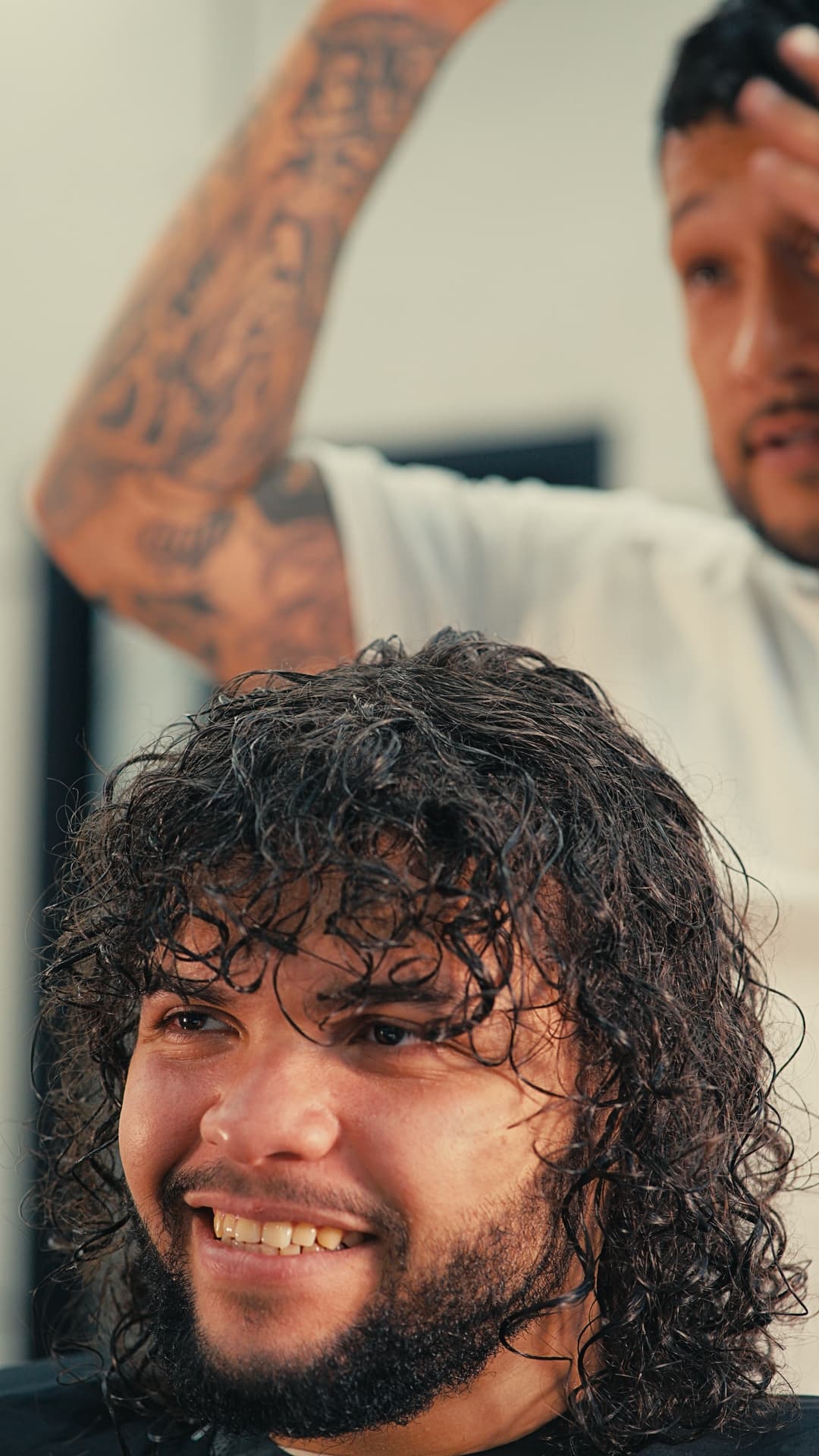 Curly hair styling — satisfied client at Success Barbershop